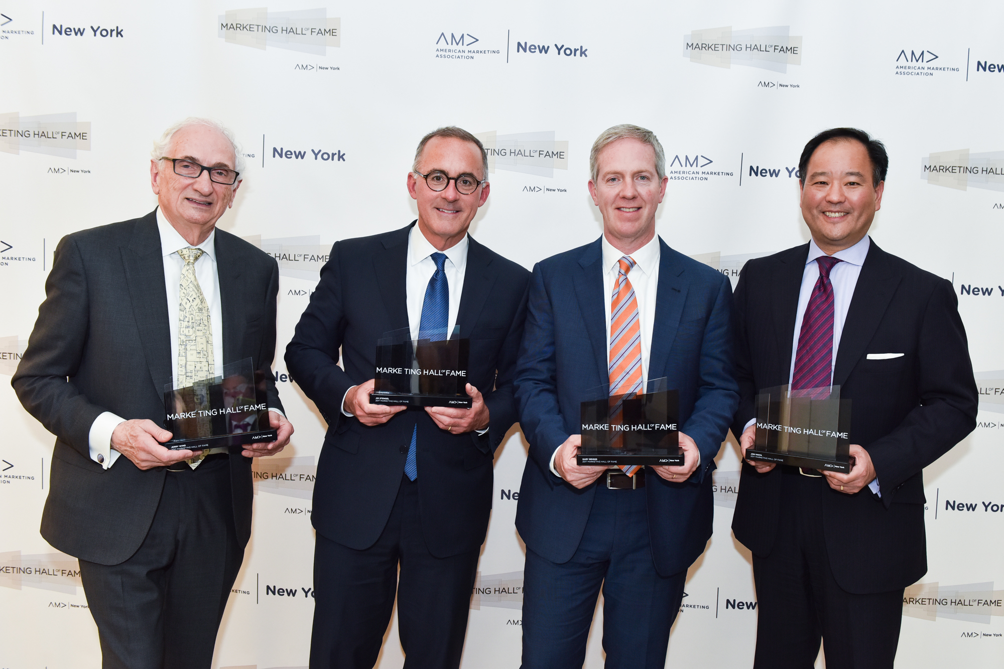 Jerry Wind, Jim Stengel, Gary Briggs, and Jon Iwata posing with their awards